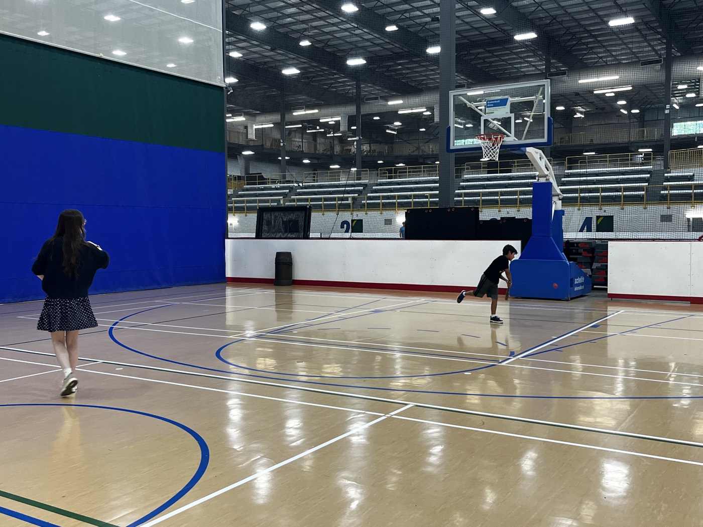 Children running and playing on an indoor sports court